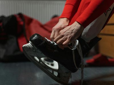 Close up of a person hands tying athletic shoes